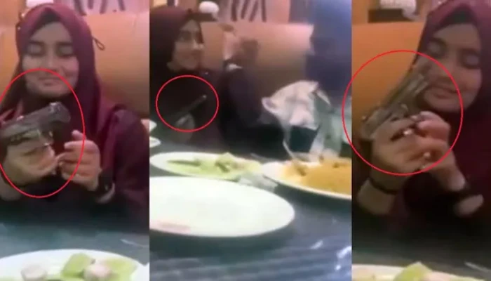 ​প্রেমিকাকে পিস্তল চালানো শেখানোর ভিডিও ভাইরাল